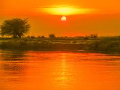Sonnenuntergang am Chobe Fluß